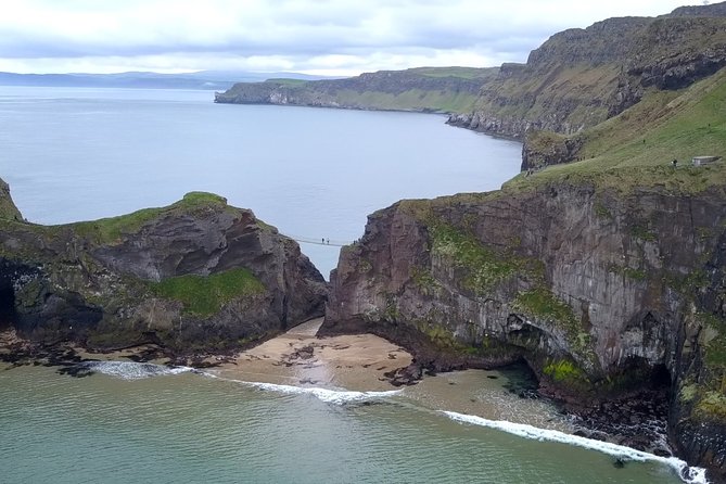 Guided Day Tour of Giant's Causeway from Belfast by Comfortable Coach - Dunluce Castle from the roadside