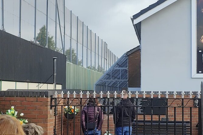 Private Belfast Black Taxi Tour - Crossing to Falls Road and a different community story