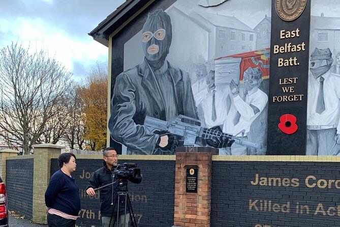 The Troubles and iconic award winning taxi 2hr private cab tour - International Mural Wall on Divis Street